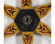 GAME WHEEL IN CHROME YELLOW PAINT WITH DECORATION REMINISCENT OF AMERICAN INDIAN ART, CHICAGO, 1910-20