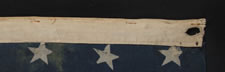 34 STARS IN 4 ROWS WITH 2 STARS OFFSET AT THE FLY END, LIKELY A UNION ARMY CAMP COLORS, OPENING TWO YEARS OF THE CIVIL WAR, 1861-1863, REFLECTS THE PERIOD WHEN KANSAS WAS THE MOST RECENT STATE TO JOIN THE UNION