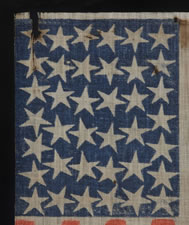 38 STAR FLAG WITH ESPECIALLY LARGE STARS AND INTERTWINED ARMS, AN ANTIQUE EXAMPLE REFLECTING COLORADO STATEHOOD, 1876-1889