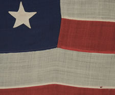 38 HAND-SEWN, SINGLE-APPLIQUED STARS ON A FLAG IN A VERY DESIRABLE SMALL SCALE FOR THE PERIOD, MADE BY ANNIN IN NEW YORK CITY, 1876-1889, COLORADO STATEHOOD
