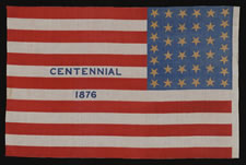 38 STAR ANTIQUE FLAG WITH "1876 CENTENNIAL" ADVERTISING & GOLD STARS, MADE FOR THE PHILADELPHIA CENTENNIAL INTERNATIONAL EXPOSITION