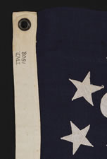 13 STAR PRIVATE YACHT ENSIGN, A NICE GRAPHIC EXAMPLE WITH AN ATTRACTIVE, CANTED ANCHOR, DATED 1908