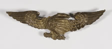 PRESSED BRASS EAGLE, AN EARLY PARADE FLAG HOLDER & BUNTING TIE-BACK, AN ESPECIALLY ATTRACTIVE EXAMPLE, ca 1890
