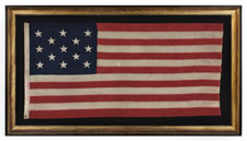 ANTIQUE AMERICAN FLAG WITH 13 STARS IN A 3-2-3-2-3 PATTERN AND AN ELONGATED PROFILE, A SMALL-SCALE FLAG OF THE 1895-1926 ERA