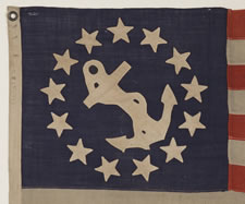 13 STAR PRIVATE YACHT FLAG, A SCARCE AND DESIRABLE EXAMPLE WITH SINGLE-APPLIQUED, HAND-SEWN STARS AND ANCHOR, MADE BY ANNIN IN NEW YORK CITY, CA 1865-1890