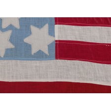 16 SIX-POINTED STARS ON A CORNFLOWER BLUE CANTON, AND A COMPLEMENT OF 13 STRIPES, ON AN ANTIQUE AMERICAN FLAG MADE OF POLISHED COTTON, LIKELY DURING THE LAST DECADE OF THE 19TH CENTURY, TO CELEBRATE THE CENTENNIAL OF TENNESSEE STATEHOOD (1796-1896)