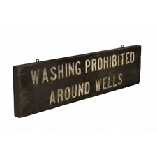 "WASHING PROHIBITED AROUND WELLS", AN EARLY-MID 20TH CENTURY SIGN