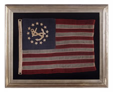 THE SMALLEST PRIVATE YACHT ENSIGN I HAVE EVER SEEN WITH HAND-SEWN STARS AND A CANTED ANCHOR, 1876-1890