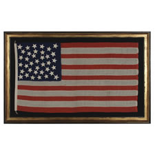 37 STARS IN A MEDALLION CONFIGURATION ON AN ANTIQUE AMERICAN FLAG OF THE 1867-1876 PERIOD, IN A RARE AND DESIRABLE SMALL SIZE, NEBRASKA STATEHOOD