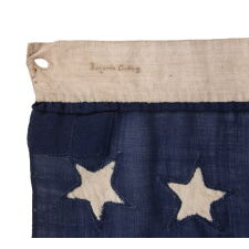 18 STAR ANTIQUE AMERICAN FLAG WITH 13 STRIPES, A “DISUNION” FLAG, MADE WITH AN ABOLITIONIST MESSAGE, circa 1859-1861, EXCLUDING THE SLAVE STATES; WITH A 19th STAR ADDED ON THE OBVERSE; OWNED BY HARVARD-TRAINED, MASSACHUSETTS PHYSICIAN BENJAMIN CUSHING, WHO VOLUNTEERED AS A U.S. ARMY SURGEON, DEVOID OF RANK OR PAY, STATIONED AT FORT MONROE, VIRGINIA, ‘CONTRABAND CAMP’ FOR ESCAPING SLAVES AND THE ONLY UNION-CONTROLLED, FORTIFIED BASE IN THE UPPER SOUTH