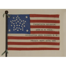 38 STAR ANTIQUE AMERICAN FLAG WITH A RARE AND BEAUTIFUL VARIATION OF THE "GREAT STAR" OR "GREAT LUMINARY" PATTERN, AN EXAMPLE OF EXTRAORDINARY QUALITY, MADE BY R.W. MUSGROVE IN BRISTOL, NEW HAMPSHIRE FOR AN 1885 REUNION OF THE 12th NH VOLUNTEERS