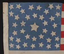 38 STARS ON A CORNFLOWER BLUE CANTON, IN A MEDALLION CONFIGURATION, WITH A RARE GROUPING OF 3 STARS IN EACH CORNER, 1876-1889, COLORADO STATEHOOD