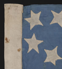 38 STARS ON A CORNFLOWER BLUE CANTON, IN A MEDALLION CONFIGURATION, WITH A RARE GROUPING OF 3 STARS IN EACH CORNER, 1876-1889, COLORADO STATEHOOD