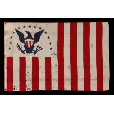 LATE 19th CENTURY FLAG OF THE REVENUE MARINE (a.k.a., REVENUE CUTTER SERVICE), WITH A BLUE EAGLE AMID AN ARCH OF 13 BLUE STARS, ON A WHITE CANTON, AND 16 RED & WHITE, VERTICAL STRIPES, MADE circa 1885-1895