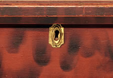 EXCEPTIONALLY RARE, RED-PAINTED, SMOKE-DECORATED BLANKET CHEST, CA 1810-1840
