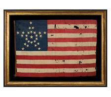 26 STAR AMERICAN NATIONAL FLAG, ENTIRELY HAND-SEWN AND MADE OF SILK, WITH EMBROIDERED STARS ARRANGED IN THE FORM OF A WHIMSICAL GREAT STAR PATTERN. AN EXTRAORDINARY EXAMPLE IN A RARE, SMALL SIZE, MICHIGAN STATEHOOD, 1837-1845