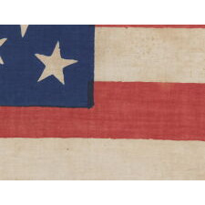 26 STAR AMERICAN PARADE FLAG, MADE FOR THE 1844 PRESIDENTIAL CAMPAIGN OF HENRY CLAY AND THEODORE FRELINGHUYSEN, WITH CLAY’S PORTRAIT SET WITHIN AN OAK LEAF & GEAR COG MEDALLION AND THE RARE PRESENCE OF SUCCESSFUL DELAWARE COATTAIL CANDIDATES STOCKTON & HOUSTON