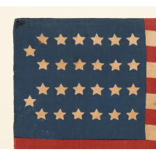 26 STAR ANTIQUE AMERICAN PARADE FLAG WITH 11 STRIPES AND IT’S CANTON RESTING ON THE “WAR STRIPE.” THE EARLIEST KNOWN STAR COUNT FOR PRINTED EXAMPLES, 1837-1846, MICHIGAN STATEHOOD