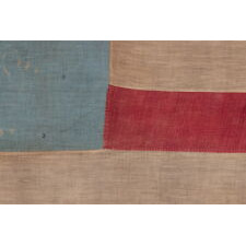28 STAR ANTIQUE AMERICAN FLAG, REFLECTS THE ADDITION OF TEXAS TO THE UNION AS THE 28TH STATE IN 1845, WITH ITS STARS ARRANGED IN A GREAT STAR PATTERN – AN ESPECIALLY FITTING CONFIGURATION FOR THE ‘LONE STAR’ STATE – ON A CORNFLOWER BLUE CANTON; OFFICIAL FOR JUST ONE YEAR (1846-1847), AND THE BEST OF ALL EXAMPLES PRESENTLY KNOWN IN BOTH PUBLIC AND PRIVATE COLLECTIONS