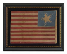 31 STARS AND 17 STRIPES, THE ONLY KNOWN EXAMPLE IN THIS STYLE WITH A "GREAT STAR" PATTERN THAT CONTAINS A GIGANTIC CENTER STAR AND 17 STRIPES, PROBABLY MADE WITH SOUTHERN SYMPATHIES, CANTON RESTING ON THE "BLOOD STRIPE", PRE-CIVIL WAR, CALIFORNIA STATEHOO
