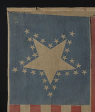 31 STARS AND 17 STRIPES, THE ONLY KNOWN EXAMPLE IN THIS STYLE WITH A "GREAT STAR" PATTERN THAT CONTAINS A GIGANTIC CENTER STAR AND 17 STRIPES, PROBABLY MADE WITH SOUTHERN SYMPATHIES, CANTON RESTING ON THE "BLOOD STRIPE", PRE-CIVIL WAR, CALIFORNIA STATEHOO