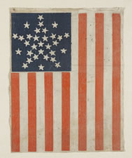 31 STARS ARRANGED IN A RARE VARIATION OF THE "GREAT STAR" PATTERN THAT HAS A STAR BETWEEN EACH ARM, PRE-CIVIL WAR, CALIFORNIA STATEHOOD, 1850-1858