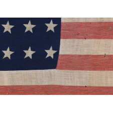 32 STAR ANTIQUE AMERICAN FLAG OF A TYPE KNOWN TO HAVE LIKELY SEEN MILITARY USE, REFLECTS THE ADDITION OF MINNESOTA TO THE UNION IN 1858, AN EXTREMELY RARE FLAG, ACCURATE FOR JUST 9 MONTHS AND OFFICIAL FOR ONLY ONE YEAR