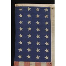 32 STARS (MINNESOTA STATEHOOD), 1858-59, PRESENTED BY A CIVIL WAR MUSICIAN WITH THE 13TH CONNECTICUT INFANTRY, AN UNUSUAL EXAMPLE WITH WOVEN STRIPES AND PRESS-DYED STARS, POSSIBLY MADE IN NEW YORK BY THE ANNIN COMPANY: