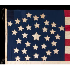 32 STARS IN A VERY UNUSUAL NOTCHED VERSION OF THE “GREAT STAR” PATTERN, WITH TWO STARS ABSENT AT THE EXTREME POINTS OF EACH ARM, MADE IN THE PERIOD WHEN MINNESOTA JOINED THE UNION AS THE 32nd STATE; A VERY RARE STAR COUNT, OFFICIAL FOR JUST ONE YEAR, AND ACCURATE FOR JUST NINE MONTHS, 1858-59