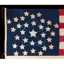 32 STARS IN A VERY UNUSUAL NOTCHED VERSION OF THE “GREAT STAR” PATTERN, WITH TWO STARS ABSENT AT THE EXTREME POINTS OF EACH ARM, MADE IN THE PERIOD WHEN MINNESOTA JOINED THE UNION AS THE 32nd STATE; A VERY RARE STAR COUNT, OFFICIAL FOR JUST ONE YEAR, AND ACCURATE FOR JUST NINE MONTHS, 1858-59