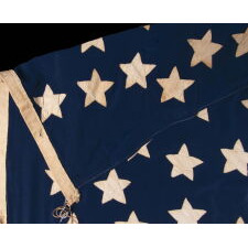 32 STARS IN A VERY UNUSUAL NOTCHED VERSION OF THE “GREAT STAR” PATTERN, WITH TWO STARS ABSENT AT THE EXTREME POINTS OF EACH ARM, MADE IN THE PERIOD WHEN MINNESOTA JOINED THE UNION AS THE 32nd STATE; A VERY RARE STAR COUNT, OFFICIAL FOR JUST ONE YEAR, AND ACCURATE FOR JUST NINE MONTHS, 1858-59