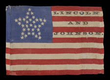 33 STARS IN A "GREAT STAR" PATTERN ON A SILK FLAG MADE FOR THE 1864 PRESIDENTIAL CAMPAIGN OF ABRAHAM LINCOLN AND ANDREW JOHNSON, ONE OF TWO KNOWN EXAMPLES IN THIS RARE STYLE