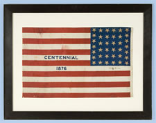 38 STAR ANTIQUE AMERICAN FLAG WITH "1876 CENTENNIAL" ADVERTISING & GOLD STARS, MADE FOR THE CENTENNIAL INTERNATIONAL EXPOSITION IN PHILADELPHIA