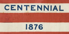 38 STAR ANTIQUE AMERICAN FLAG WITH "1876 CENTENNIAL" ADVERTISING & GOLD STARS, MADE FOR THE CENTENNIAL INTERNATIONAL EXPOSITION IN PHILADELPHIA