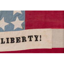 EXCEPTIONAL 34 STAR ANTIQUE AMERICAN CIVIL WAR FLAG WITH A CORNFLOWER BLUE CANTON, HOMEMADE & ENTIRELY HAND-SEWN ca 1861-63, WITH STRIPES THAT BEGIN & END ON WHITE, IN A COUNT OF 9 TO OMIT THE 4 SECEDED STATES FROM AMONG THE ORIGINAL 13 COLONIES, AND WITH APPLIED PANELS THAT READ: “PEACE & LIBERTY”; GIVEN TO DAVIS CAMRON OF “D” Co., 38th OH VOL. BY THE FAMILY OF ORRIN TAYLOR OF “D” & “F” Co.'s, 67th OH INFT'Y, MORTALLY WOUNDED AT APPOMATTOX ON THE VERY DAY OF LEE'S SURRENDER