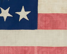 34 STARS, 1861-63, AN EXTRAORDINARY EXAMPLE WITH PATTERNED RED STRIPES, THE ONLY SUCH FLAG KNOWN WITH THIS RARE TRAIT, THOUGHT TO HAVE BEEN MADE BY HANNAH MARIA PERKINS FOR NEW YORK FINANCIAL MAGNATE DANIEL PARISH