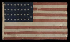 34 STARS IN 4 ROWS WITH 2 STARS OFFSET AT THE FLY END, LIKELY A UNION ARMY CAMP COLORS, OPENING TWO YEARS OF THE CIVIL WAR, 1861-1863, REFLECTS THE PERIOD WHEN KANSAS WAS THE MOST RECENT STATE TO JOIN THE UNION