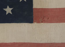 34 STARS IN 4 ROWS WITH 2 STARS OFFSET AT THE FLY END, LIKELY A UNION ARMY CAMP COLORS, OPENING TWO YEARS OF THE CIVIL WAR, 1861-1863, REFLECTS THE PERIOD WHEN KANSAS WAS THE MOST RECENT STATE TO JOIN THE UNION