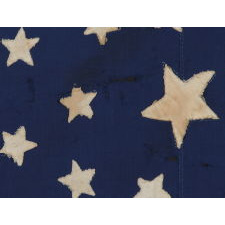34 STAR ANTIQUE AMERICAN FLAG WITH AN OUTSTANDING OVAL MEDALLION CONFIGURATION OF STARS ON A NARROW CANTON THAT RESTS ON THE 6TH STRIPE, A HOMEMADE EXAMPLE OF THE CIVIL WAR PERIOD, ENTIRELY HAND-SEWN, 1861-63, KANSAS STATEHOOD