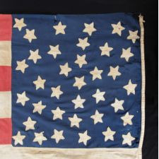 35 STARS ON ONE SIDE AND 36 ON THE OTHER, ARRANGED IN A RARE RANDOM SCATTER WITH NO PARTICULAR PATTERN, ON A CIVIL WAR PERIOD FLAG WITH GREAT FOLK QUALITIES; REPRESENTS THE ADDITION OF BOTH WEST VIRGINIA AND NEVADA, 1863-1865