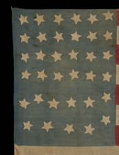 35 STARS ON A TALL & NARROW, LIGHT BLUE CANTON,  WITH INTERESTING SYMBOLISM THAT SHOWS THE 11 OFFICAL STATES OF THE CONFEDERACY IN DISSARRAY, A HOMEMADE, CIVIL WAR FLAG IN A VERY SCARCE AND DESIRABLE SIZE, 1863-65, WEST VIRGINIA STATEHOOD