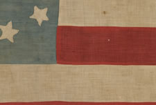 35 STARS ON A TALL & NARROW, LIGHT BLUE CANTON,  WITH INTERESTING SYMBOLISM THAT SHOWS THE 11 OFFICAL STATES OF THE CONFEDERACY IN DISSARRAY, A HOMEMADE, CIVIL WAR FLAG IN A VERY SCARCE AND DESIRABLE SIZE, 1863-65, WEST VIRGINIA STATEHOOD