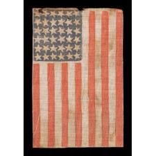 36 STAR FLAG OF THE CIVIL WAR ERA WITH UNUSUALLY LARGE AND ESPECIALLY FOLKY STARS THAT EXHIBIT SCATTERED VERTICAL ORIENTATION, 1864-1867, REFLECTS NEVADA'S ADDITION AS THE 36TH STATE