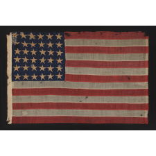 36 STARS, CIVIL WAR ERA, MADE BY ANNIN IN NEW YORK CITY, IN AN UNUSUAL TINY SIZE FOR THE PERIOD AND ENTIRELY HAND-SEWN, PROBABLY CARRIED AS A MILITARY CAMP COLORS OR GUIDON, NEVADA STATEHOOD, 1864-67