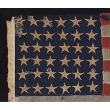 36 STARS, CIVIL WAR ERA, MADE BY ANNIN IN NEW YORK CITY, IN AN UNUSUAL TINY SIZE FOR THE PERIOD AND ENTIRELY HAND-SEWN, PROBABLY CARRIED AS A MILITARY CAMP COLORS OR GUIDON, NEVADA STATEHOOD, 1864-67