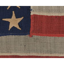 36 STARS, CIVIL WAR ERA, MADE BY ANNIN IN NEW YORK CITY, IN AN UNUSUAL TINY SIZE FOR THE PERIOD AND ENTIRELY HAND-SEWN, PROBABLY CARRIED AS A MILITARY CAMP COLORS OR GUIDON, NEVADA STATEHOOD, 1864-67