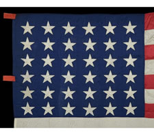 36 STARS, MADE IN 1864 IN NEW YORK CITY, AN EXTRAORDINARY, ENTIRELY HAND-SEWN SILK FLAG WITH SINGLE-APPLIQUED STARS, CIVIL WAR ERA, 1864-67