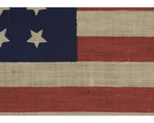 36 STARS IN A VERY ODD LINEAL CONFIGURATION FOR THIS STAR COUNT AND WITH GOLD WOOLEN FRINGE, CIVIL WAR ERA, NEVADA STATEHOOD, 1864-1867, THE ONLY KNOWN EXAMPLE IN THIS STYLE, POSSIBLY A UNION ARMY CAMP MARKER