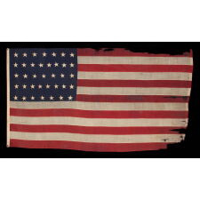 37 STAR ANTIQUE AMERICAN FLAG, ENTIRELY HAND-SEWN THROUGHOUT, WITH JUSTIFIED ROWS OF SINGLE-APPLIQUED STARS, MADE & SIGNED BY THE ANNIN COMPANY IN NEW YORK CITY, WITH SIGNIFICANT WEAR FROM EXTENDED USE; REFLECTS THE ERA WHEN NEBRASKA WAS THE MOST RECENT STATE TO JOIN THE UNION, 1867-1876