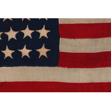 37 STAR ANTIQUE AMERICAN FLAG, MADE & SIGNED BY THE ANNIN COMPANY IN NEW YORK CITY, ENTIRELY HAND-SEWN AND WITH SINGLE-APPLIQUÉD STARS, IN A SMALL AND VERY DESIRABLE SCALE AMONG THOSE WITH PIECED-AND-SEWN CONSTRUCTION; REFLECTS THE ERA WHEN NEBRASKA WAS THE MOST RECENT STATE TO JOIN THE UNION, 1867-1876